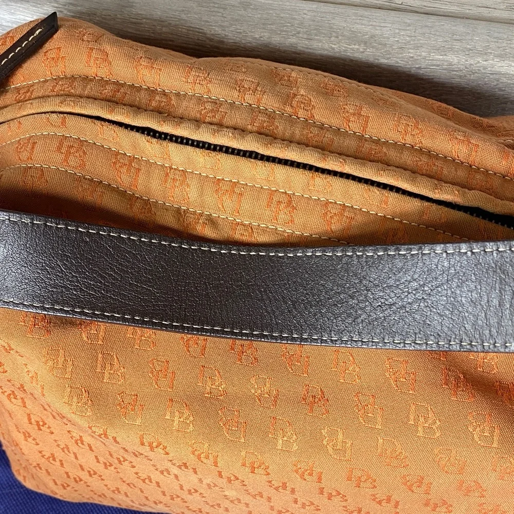Dooney & Bourke Vintage burnt Orange over the shoulder bucket Bag
